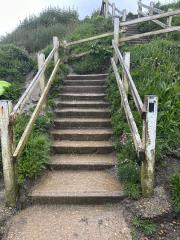 Water draining down the steps to the beach ⛈️